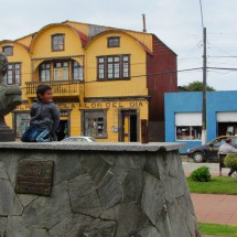 Boy with Bernardo O'Higgins, the Chilean National Hero. Yellow front of a hardware and flower store of Maulin in the background.